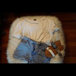 Lightwash distressed denim shorts.